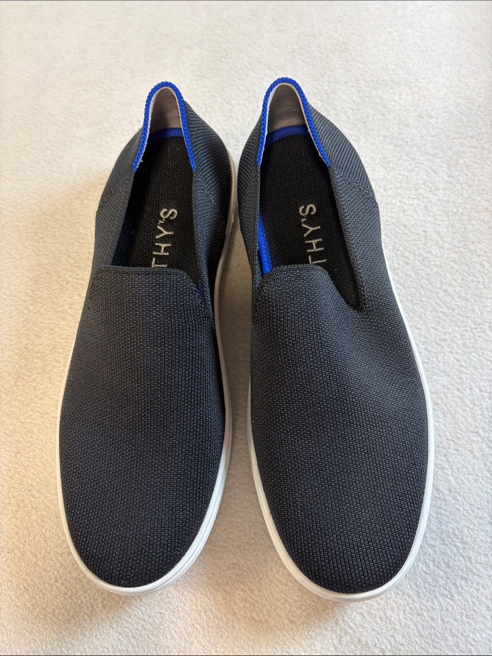 Rothy's Black Knit Slip-On Flats with Blue Trim Detail